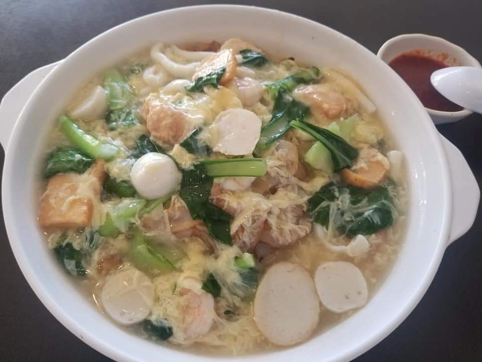 Order N13. Seafood Flat Noodles with Scrambled Egg food online from Singapore Cafe store, Sugar Land on bringmethat.com