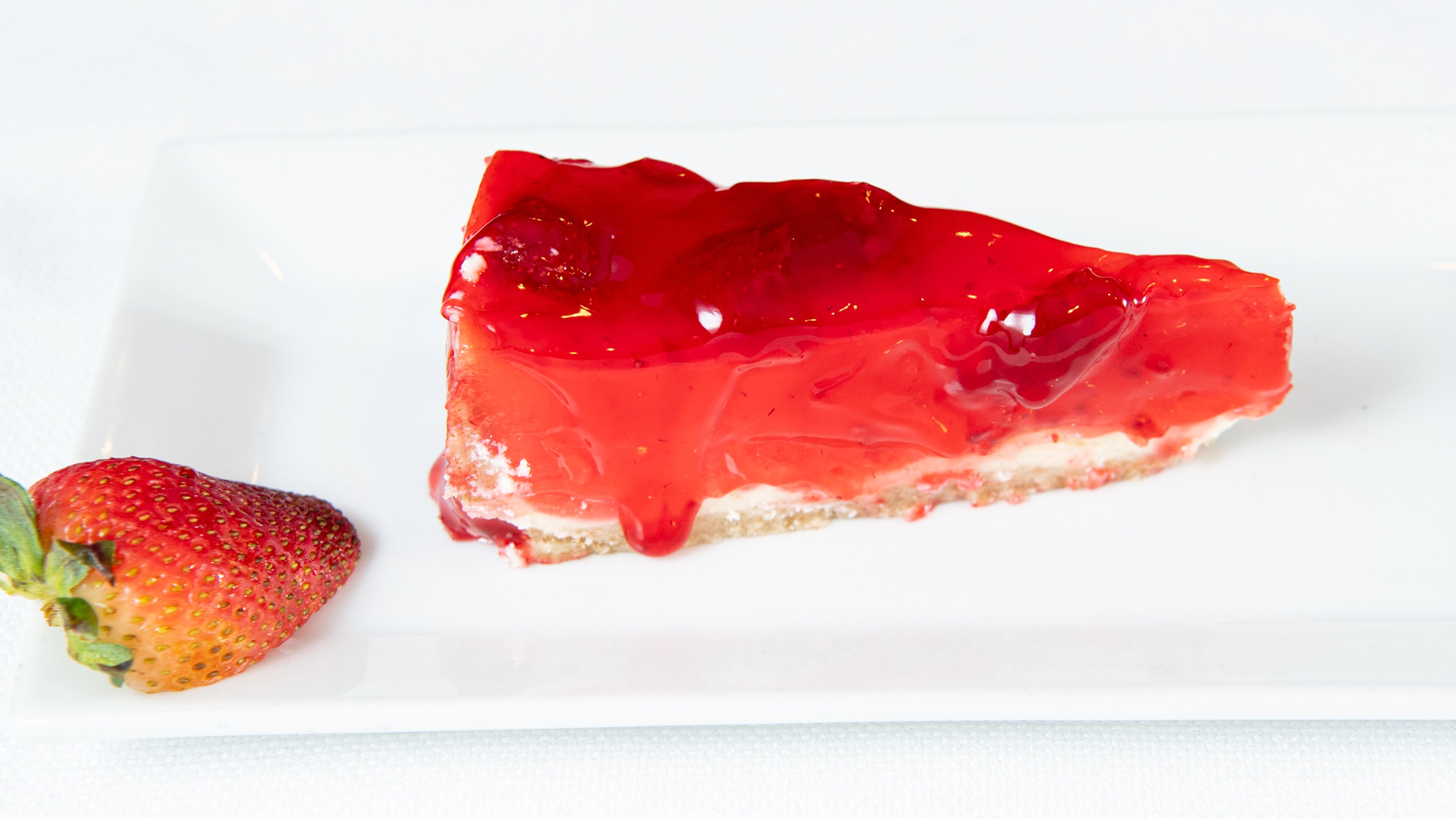 Order Cheesecake with Strawberry Topping food online from Oliveira Restaurant store, Everett on bringmethat.com