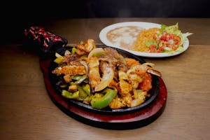 Order Trio Fajitas food online from Mauricio Mexican Food & Pizza store, Covina on bringmethat.com