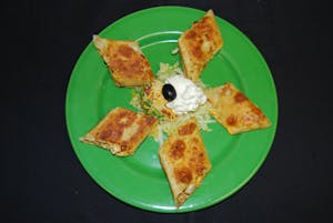 Order Rolled Quesadilla food online from Manuel's Mexican Restaurant & Cantina store, Scottsdale on bringmethat.com