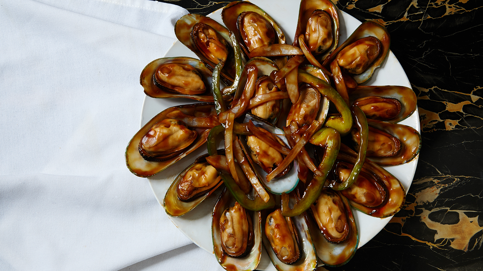 Order 70. Mussels with Special Sauce food online from Jamaica fish market store, Richmond Hill on bringmethat.com