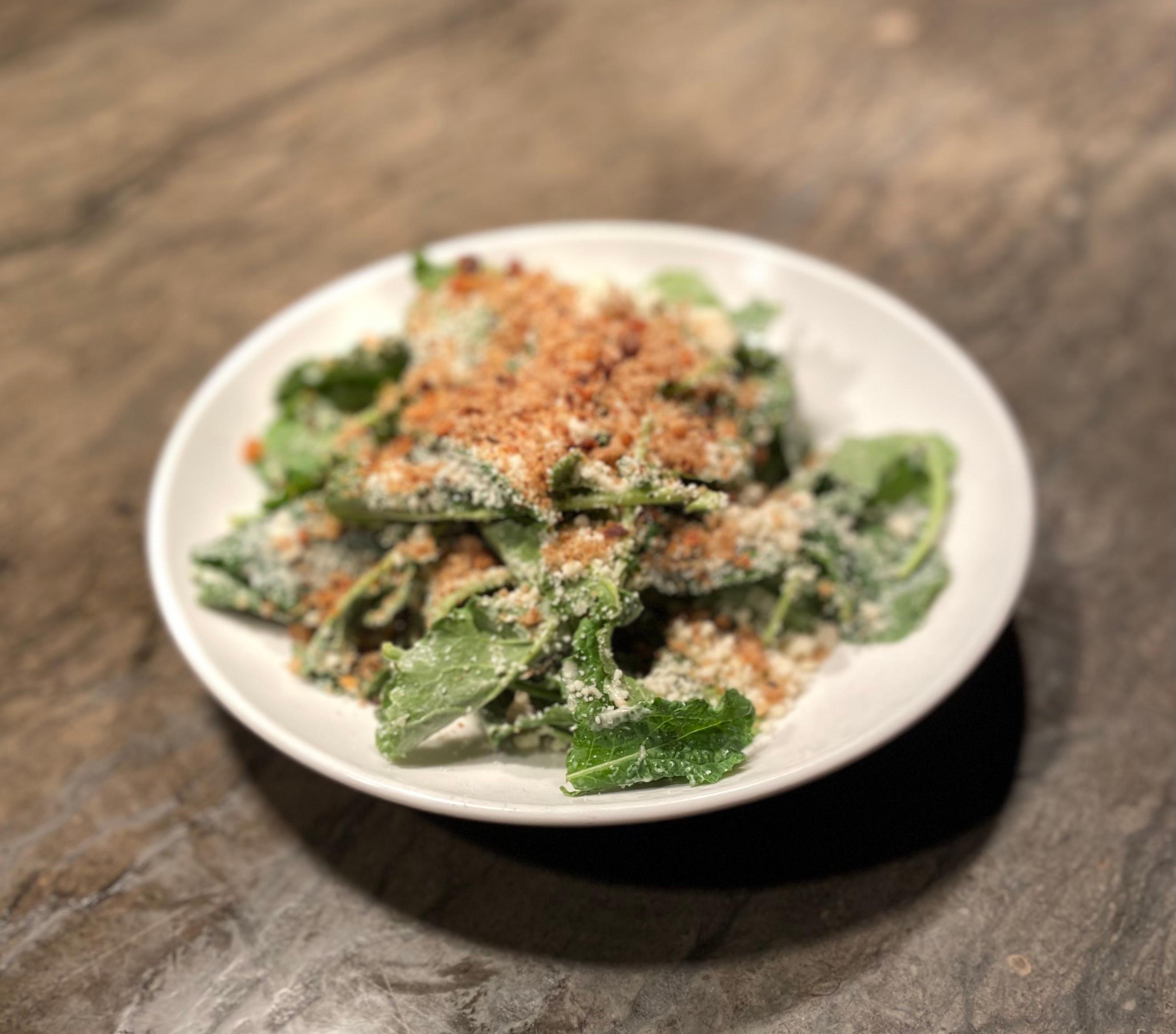 Order Baby Kale Caesar, Croutons, Parmigiana food online from Rooster's Wood-Fired Kitchen -Uptown store, Charlotte on bringmethat.com