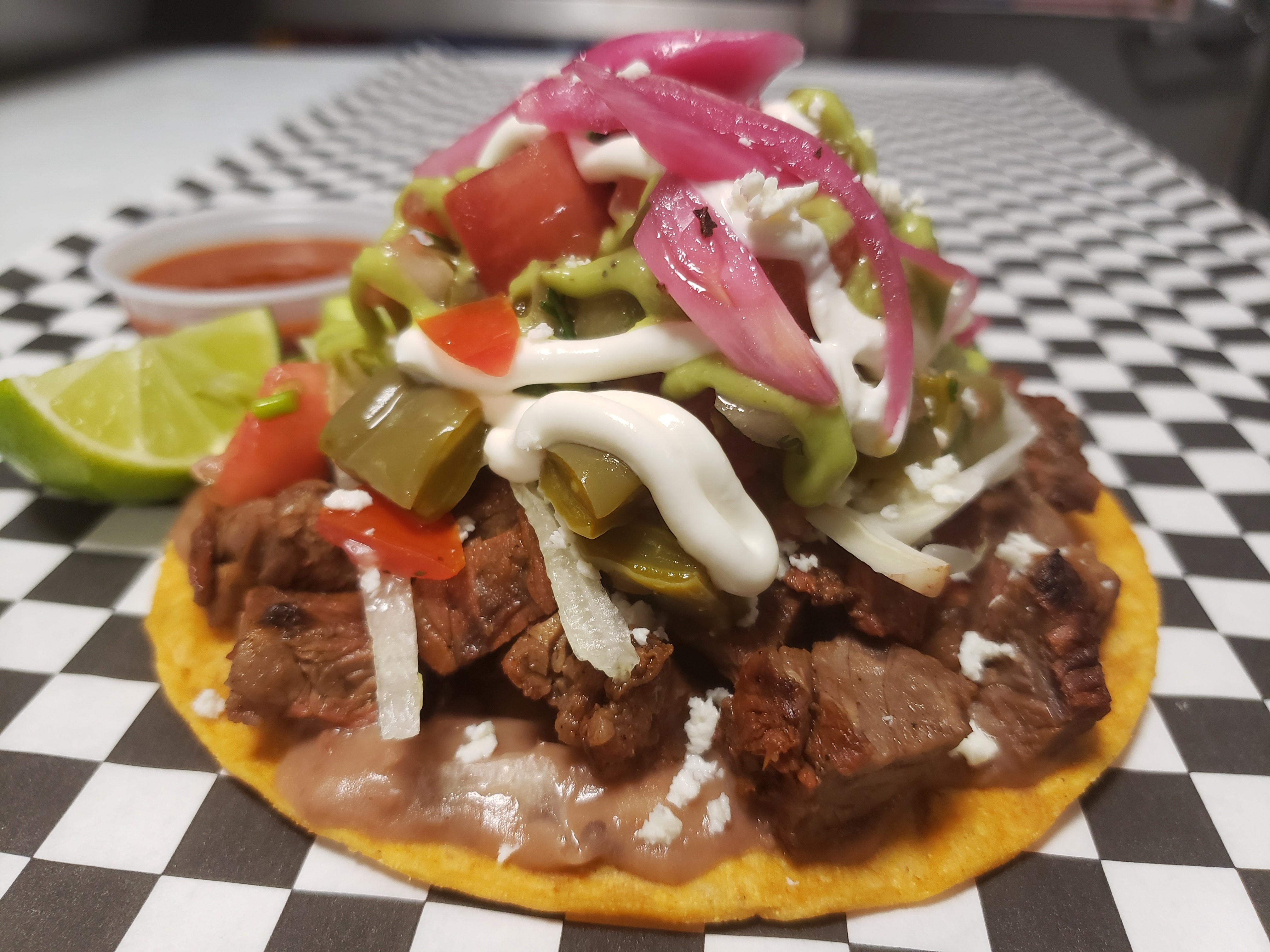Order Chef's Carne Asada Tostada food online from Happy Taco store, Los Angeles on bringmethat.com