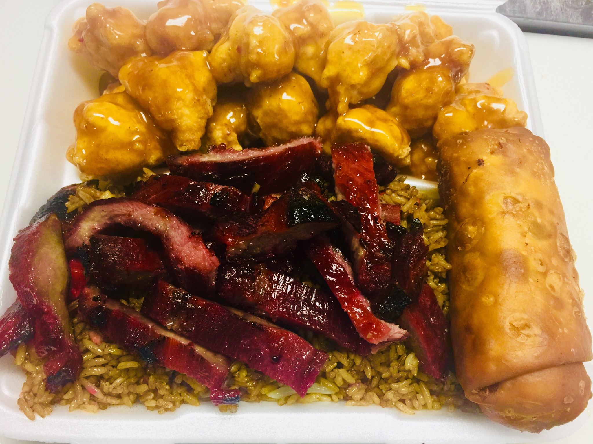 Order D27. Egg Roll, Boneless Ribs, Fried Rice and Orange Spicy Chicken Combo food online from New Hong Kong Village store, Medford on bringmethat.com