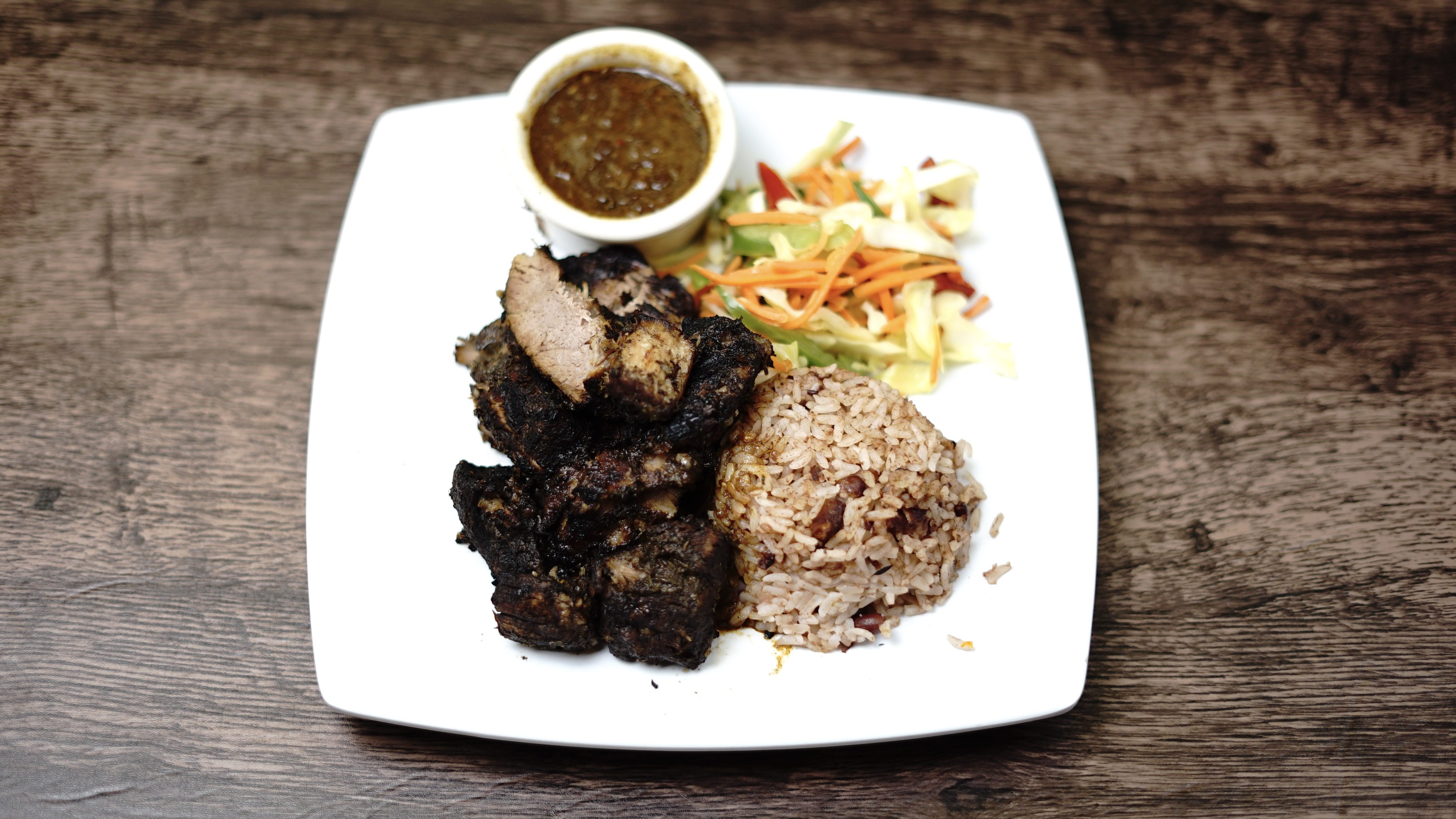 Order Jerk Pork Dinner food online from Yaad Style Jamaican Cuisine store, Portland on bringmethat.com