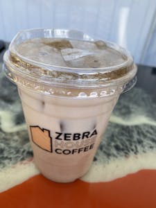 Order Caramel CF Chai (Iced) food online from Zebra House Coffee store, San Clemente on bringmethat.com