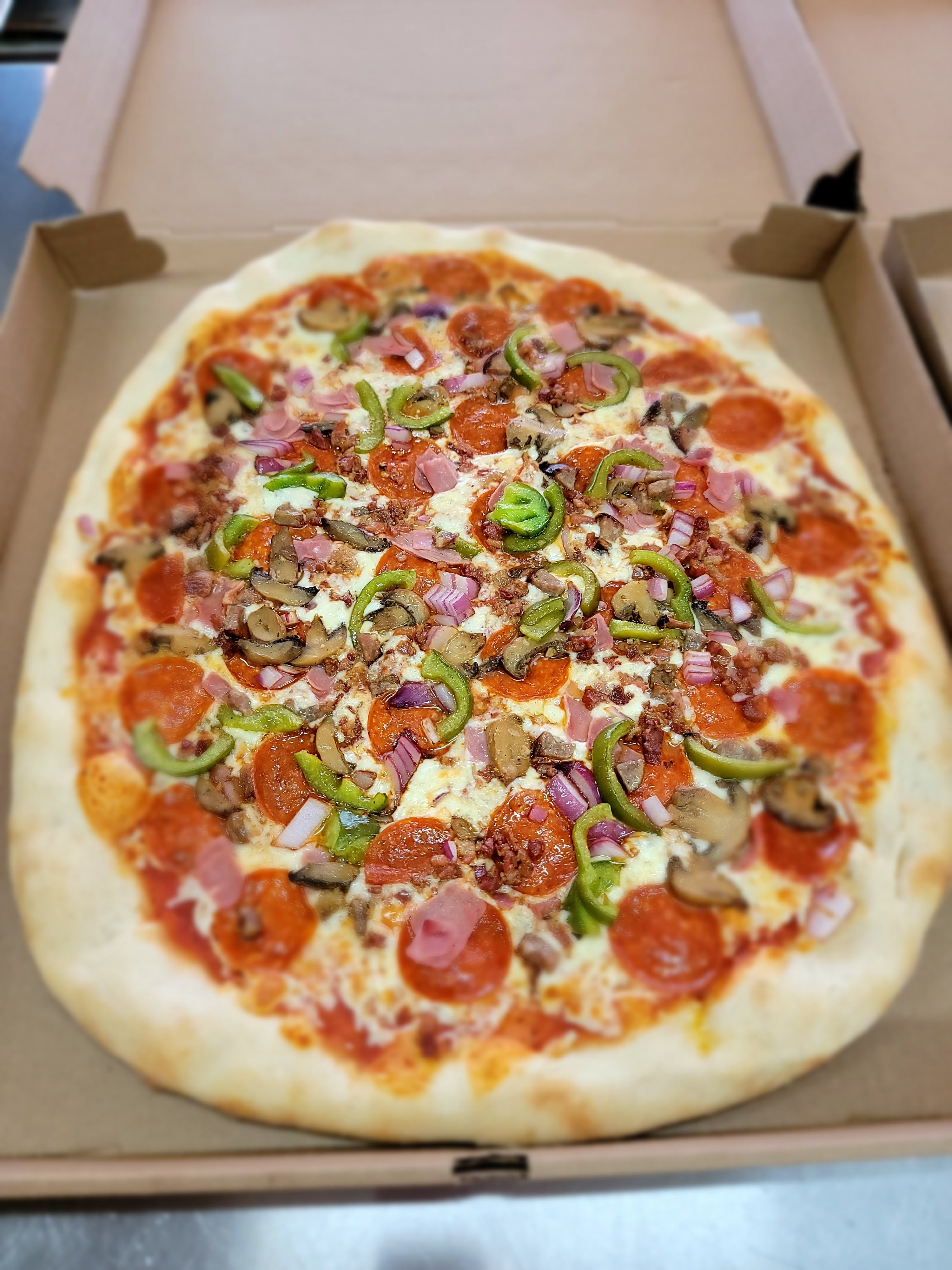 Order Deluxe Pizza - Medium 16'' food online from Tony Pizza store, Highspire on bringmethat.com