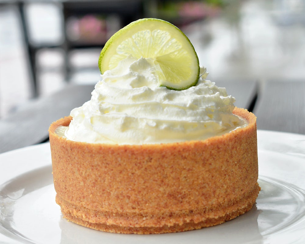 Order Key Lime Pie food online from Burtons Grill store, South Windsor on bringmethat.com