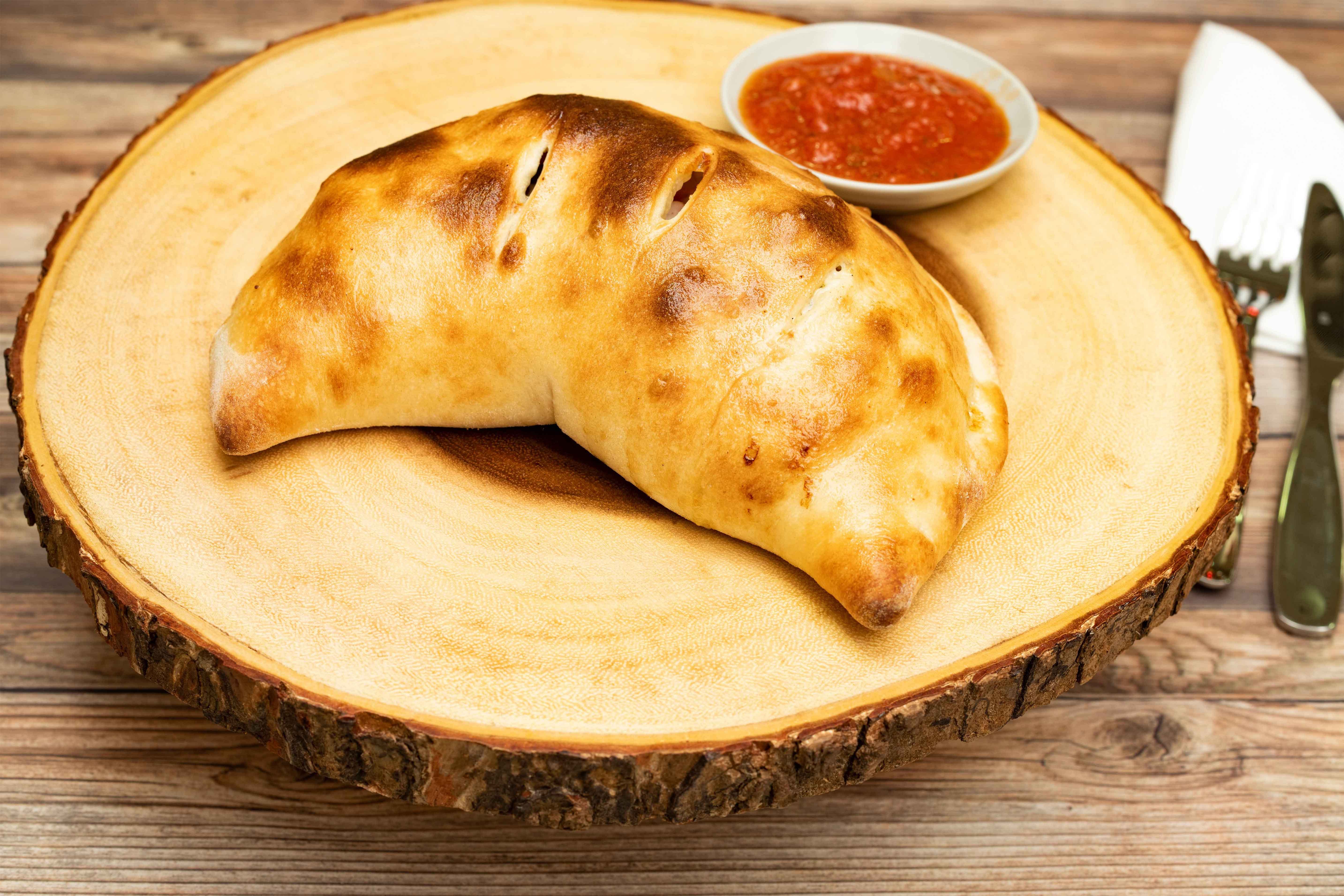 Order Spinach Calzone - Calzone food online from Papazzi Pizzeria store, Bellevue on bringmethat.com