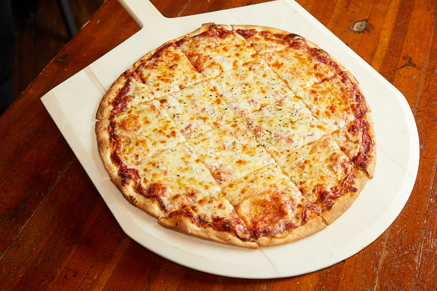Order Classic Thin Crust Cheese Pizza food online from Bartoli's Pizza store, Chicago on bringmethat.com