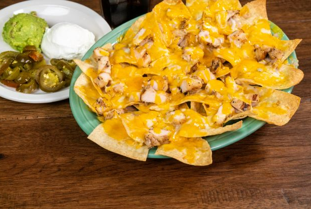 Order Deluxe Nachos  food online from Chelinos Mexican Restaurant store, Oklahoma City on bringmethat.com