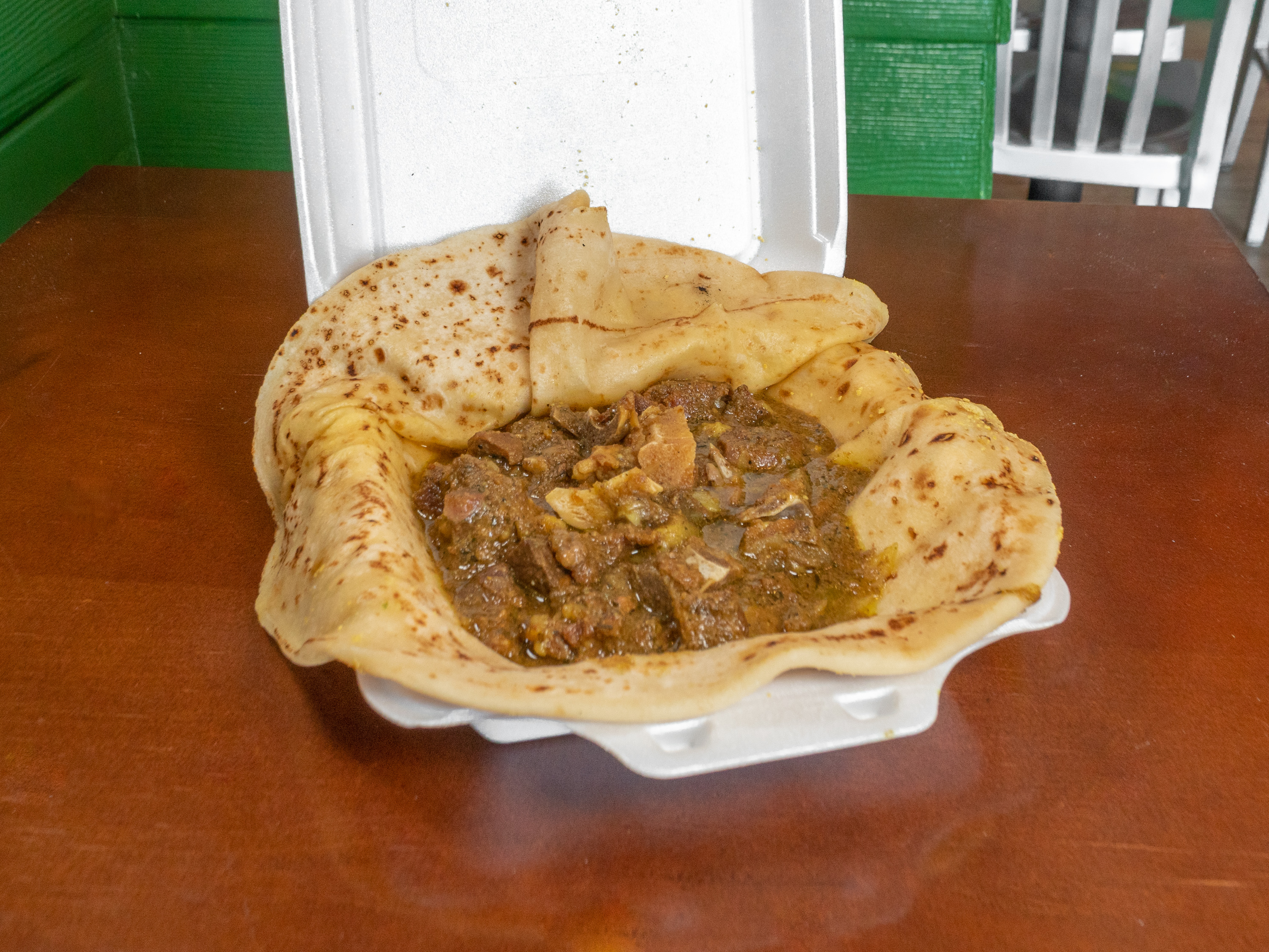 Order Curry Goat Roti food online from Caribbean Plate store, Falls Church on bringmethat.com