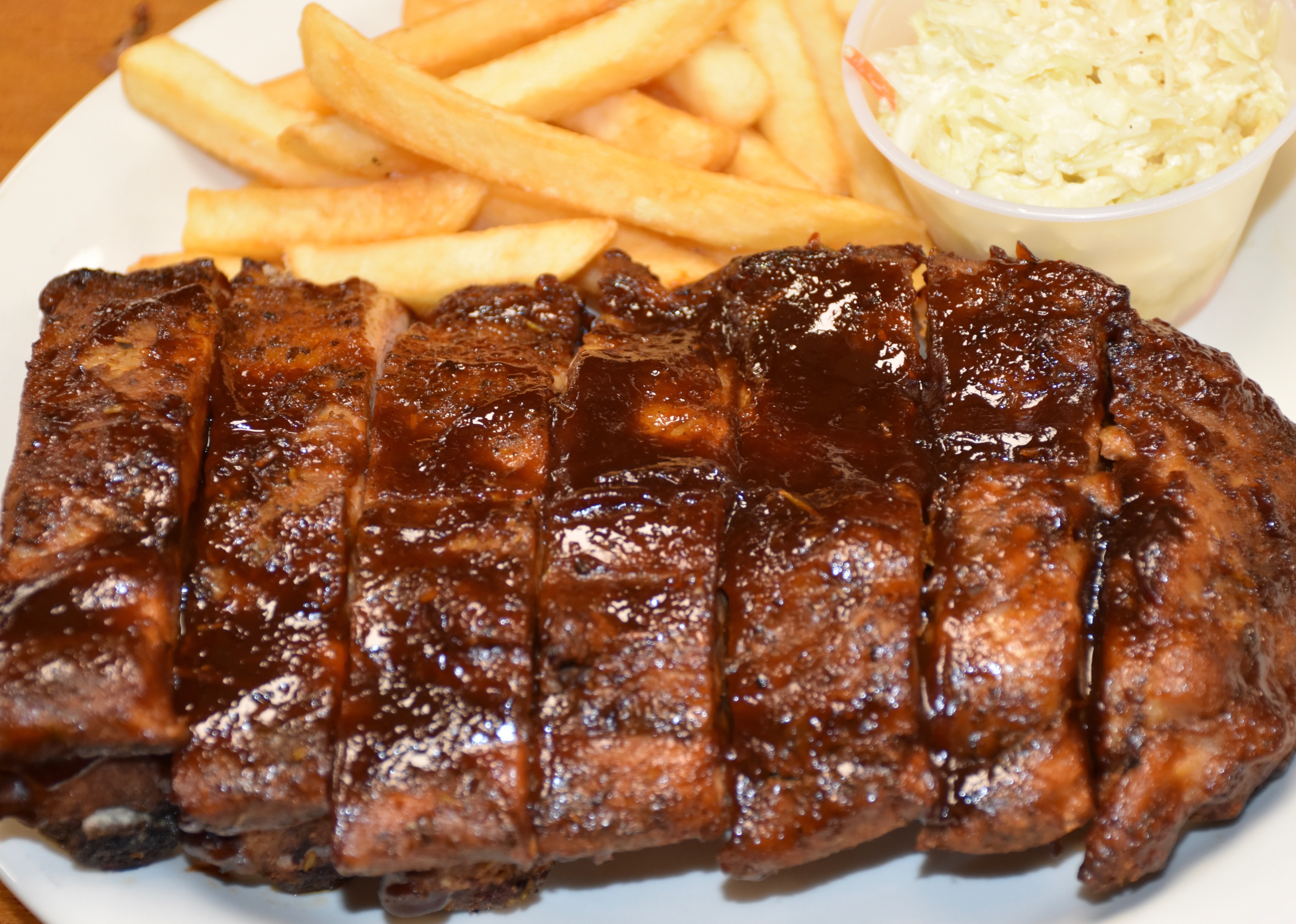 Order 1/2 Rack of Ribs food online from Pizzaman Restaurant store, Columbia on bringmethat.com