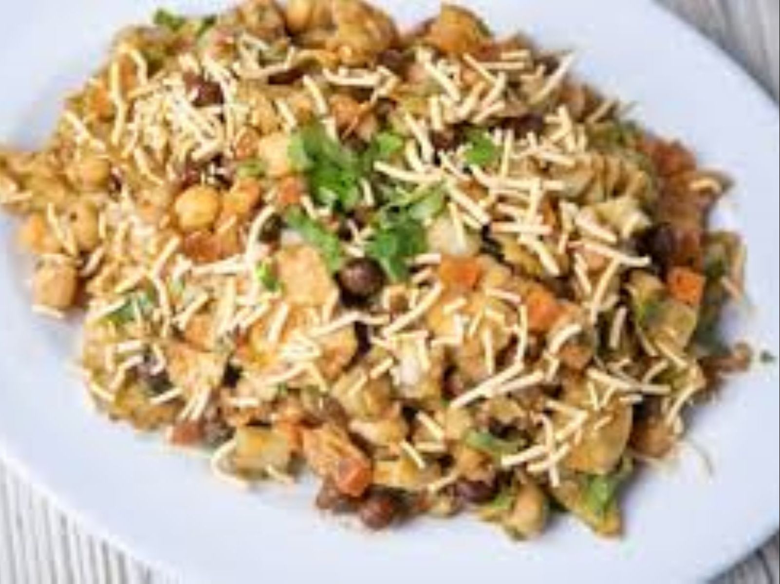 Order Samosa Chaat food online from Passage to India store, Cambridge on bringmethat.com