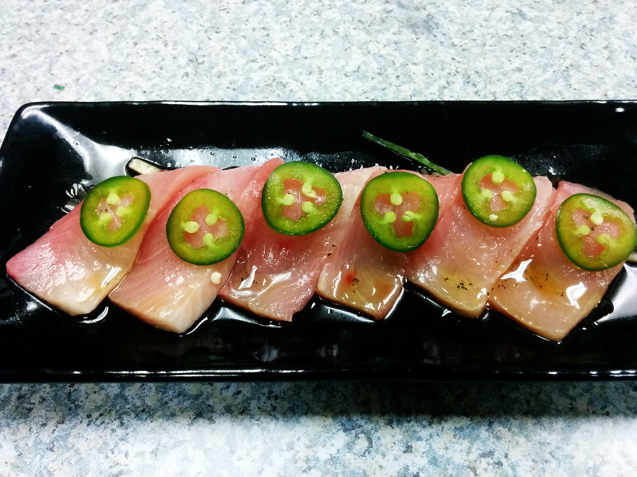 Order Hamachi jalapeno with Ponzu food online from Musashi Exotic Japanese Cuisine store, Feasterville-Trevose on bringmethat.com