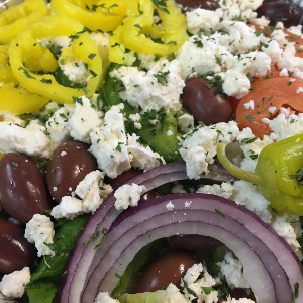 Order Greek Salad food online from Pellegrini Pizza store, Las Vegas on bringmethat.com