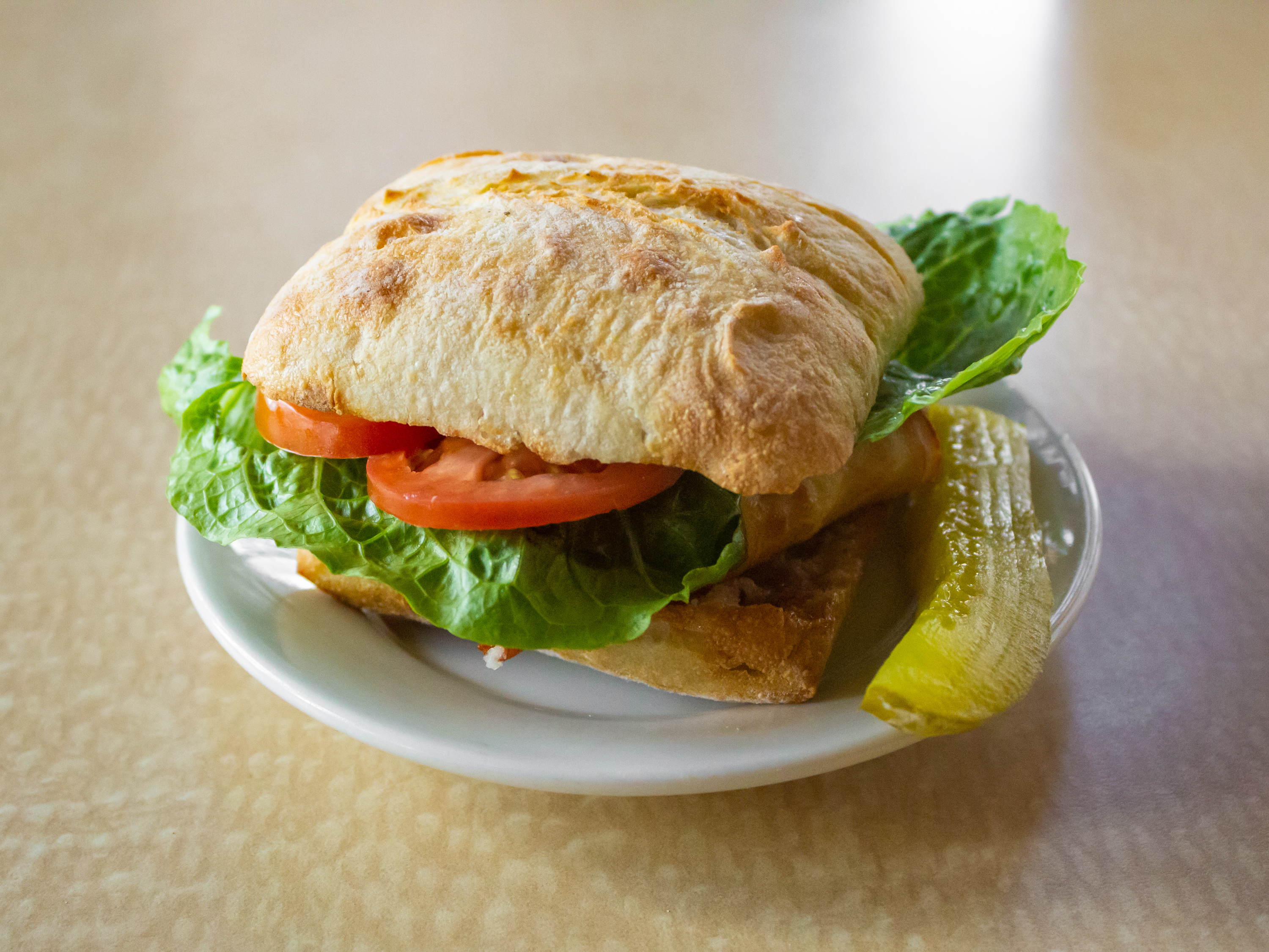 Order Simply Hot Shaved Chicken on Ciabatta sandwich food online from 1872 Cafe store, Rochester on bringmethat.com