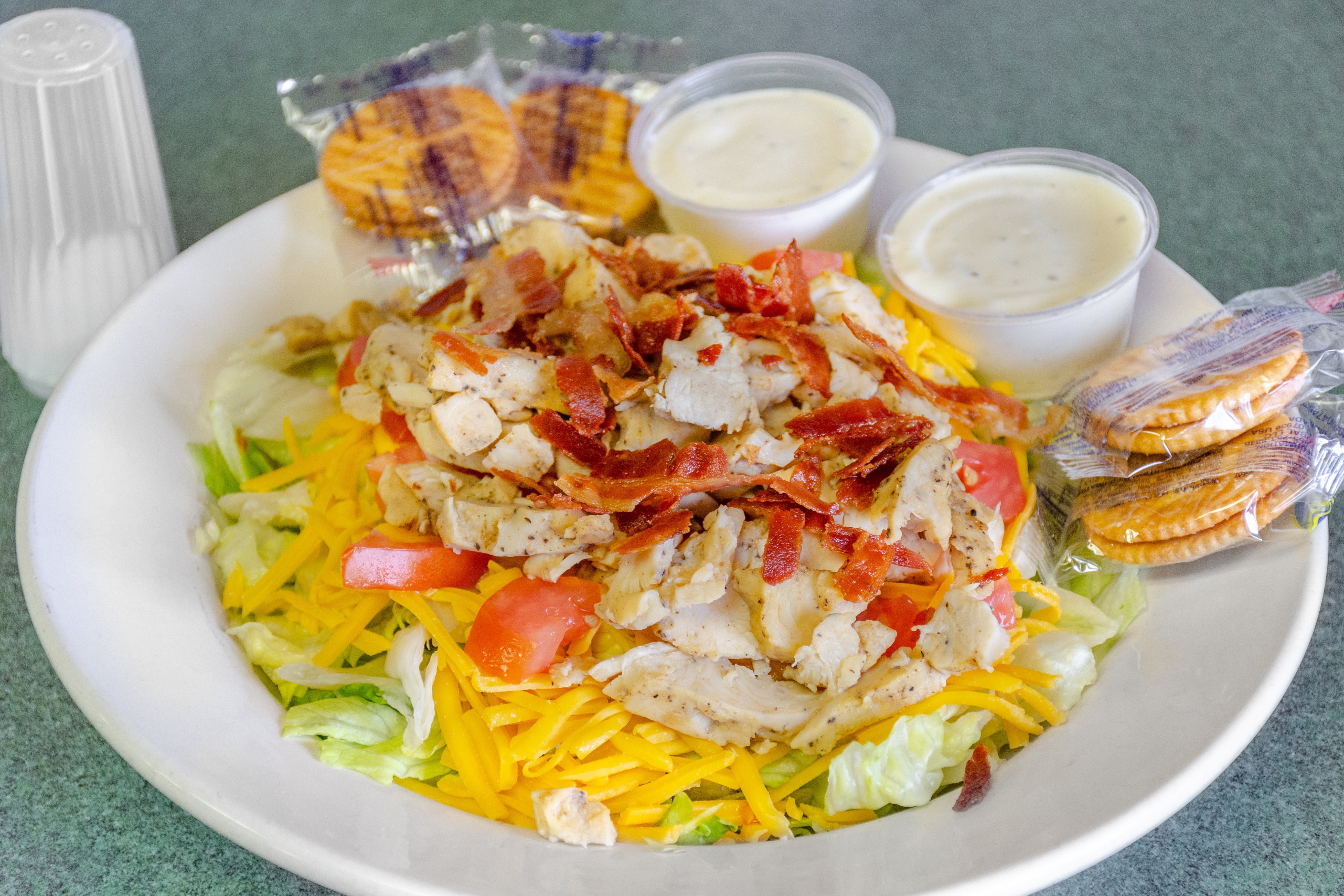 Order Chicken Bacon Ranch Salad - Small food online from Saucy Sisters Pizzeria store, Leesburg on bringmethat.com
