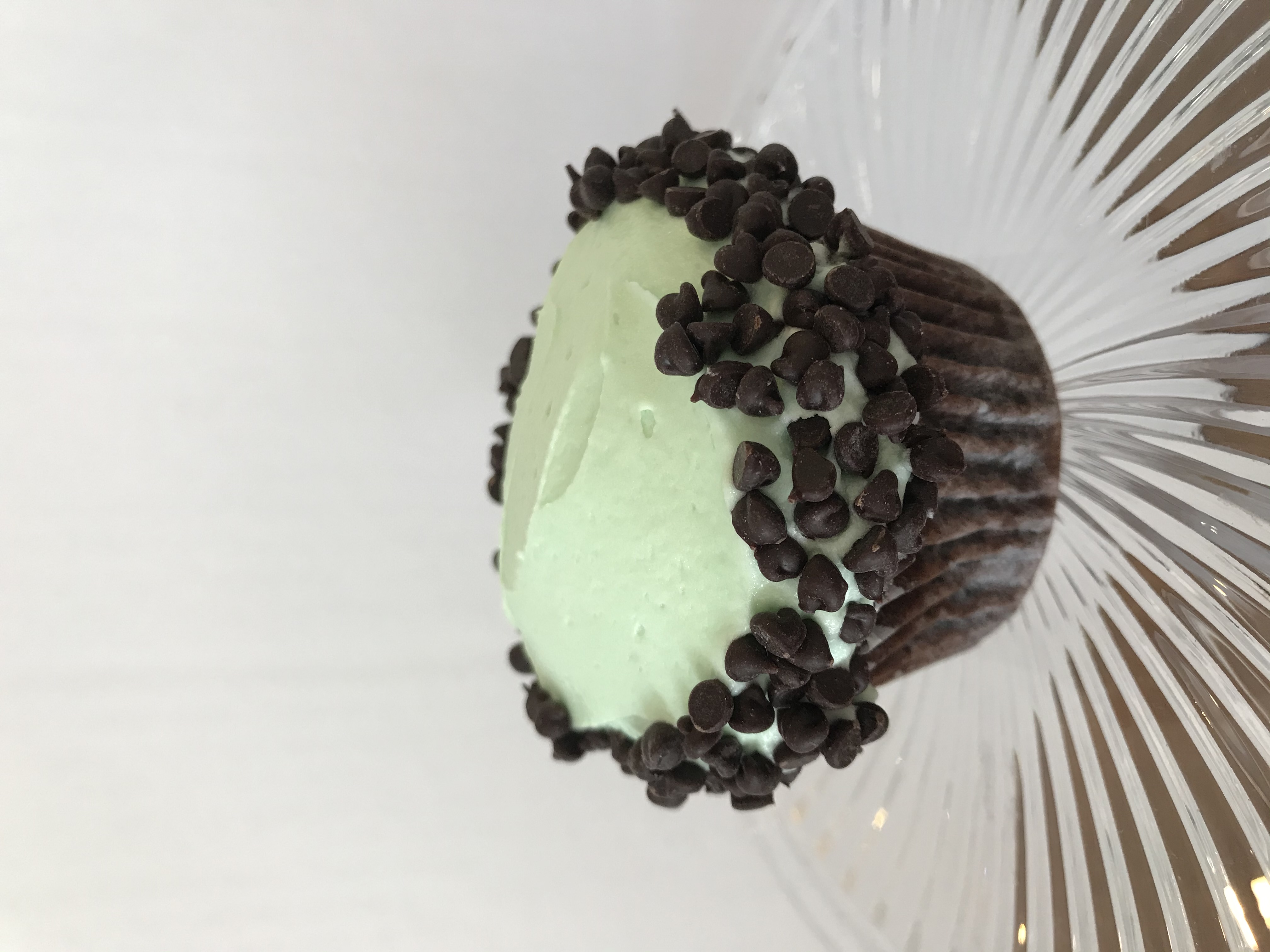 Order Mint Chocolate Chip Cupcake food online from Sugar Blossom Bake Shop store, San Clemente on bringmethat.com
