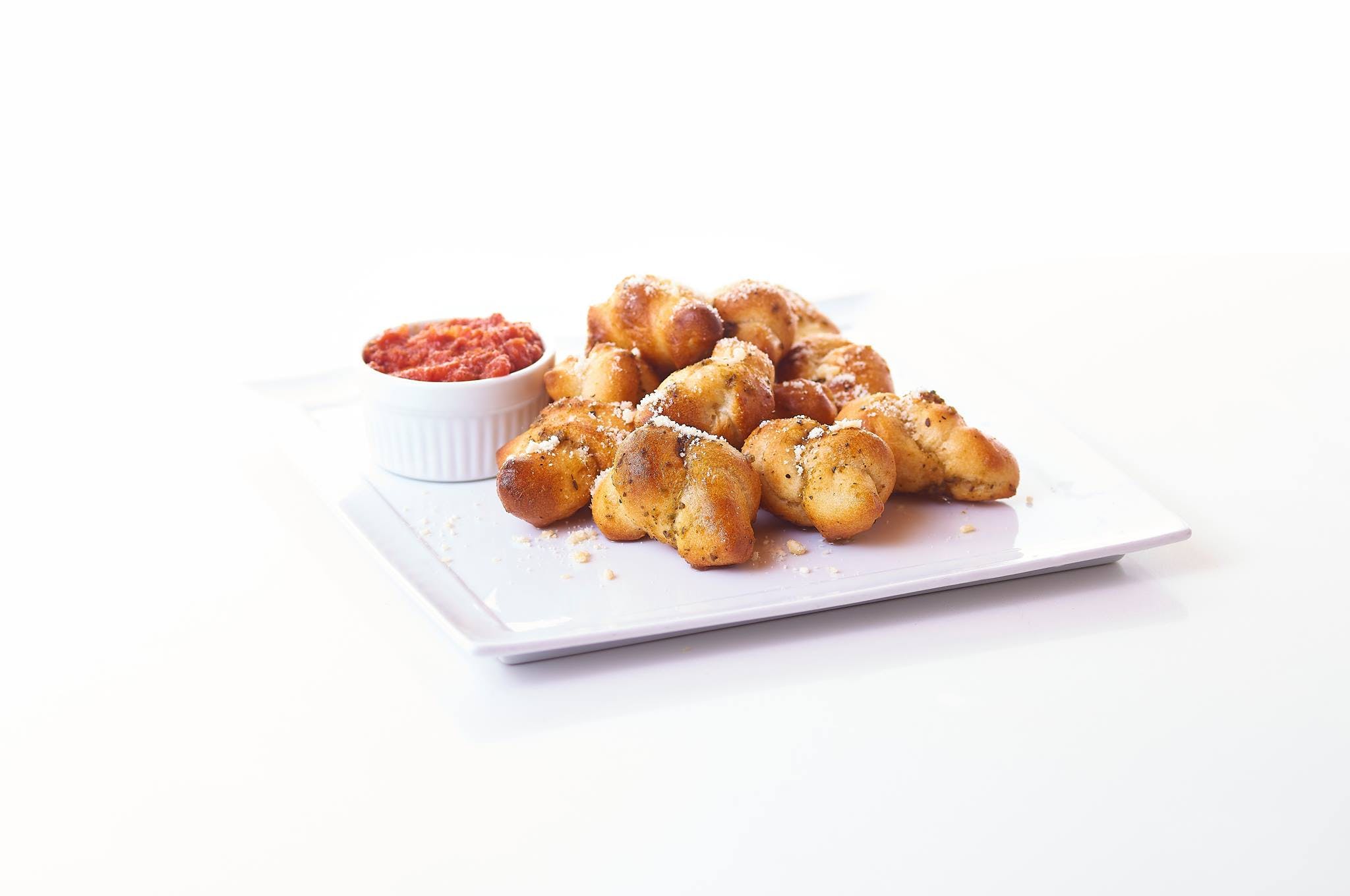 Order Garlic Knots - 6 Pieces food online from Paisano Pizza store, Alexandria on bringmethat.com