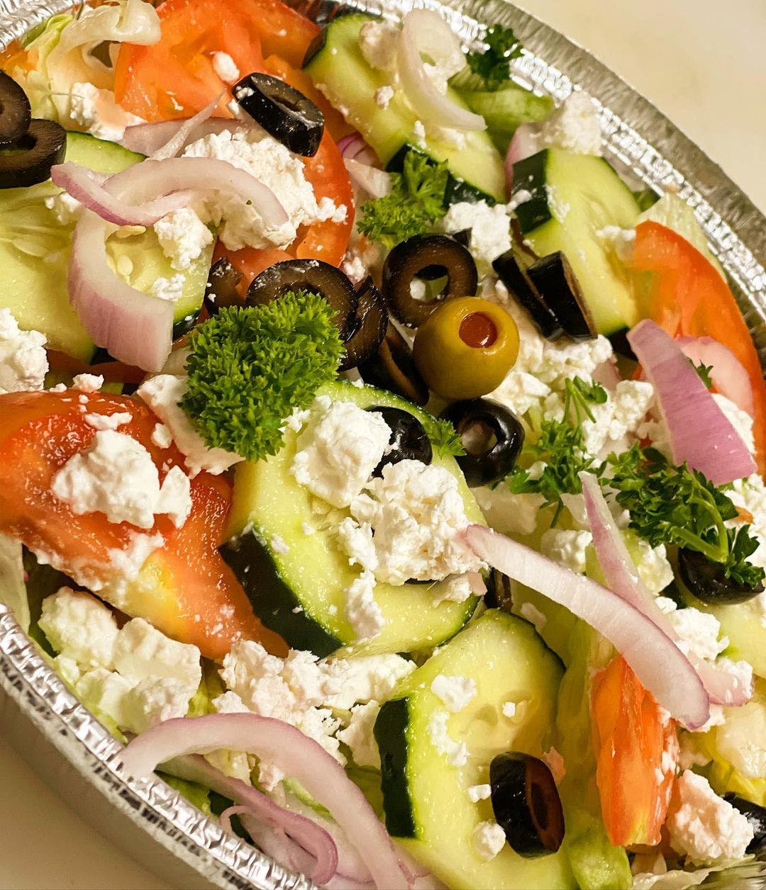 Order Greek Salad - Salad food online from Mano's Pizza store, Annandale on bringmethat.com