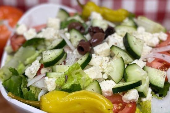 Order Greek Salad food online from Manny & Olga's Pizza store, Washington on bringmethat.com