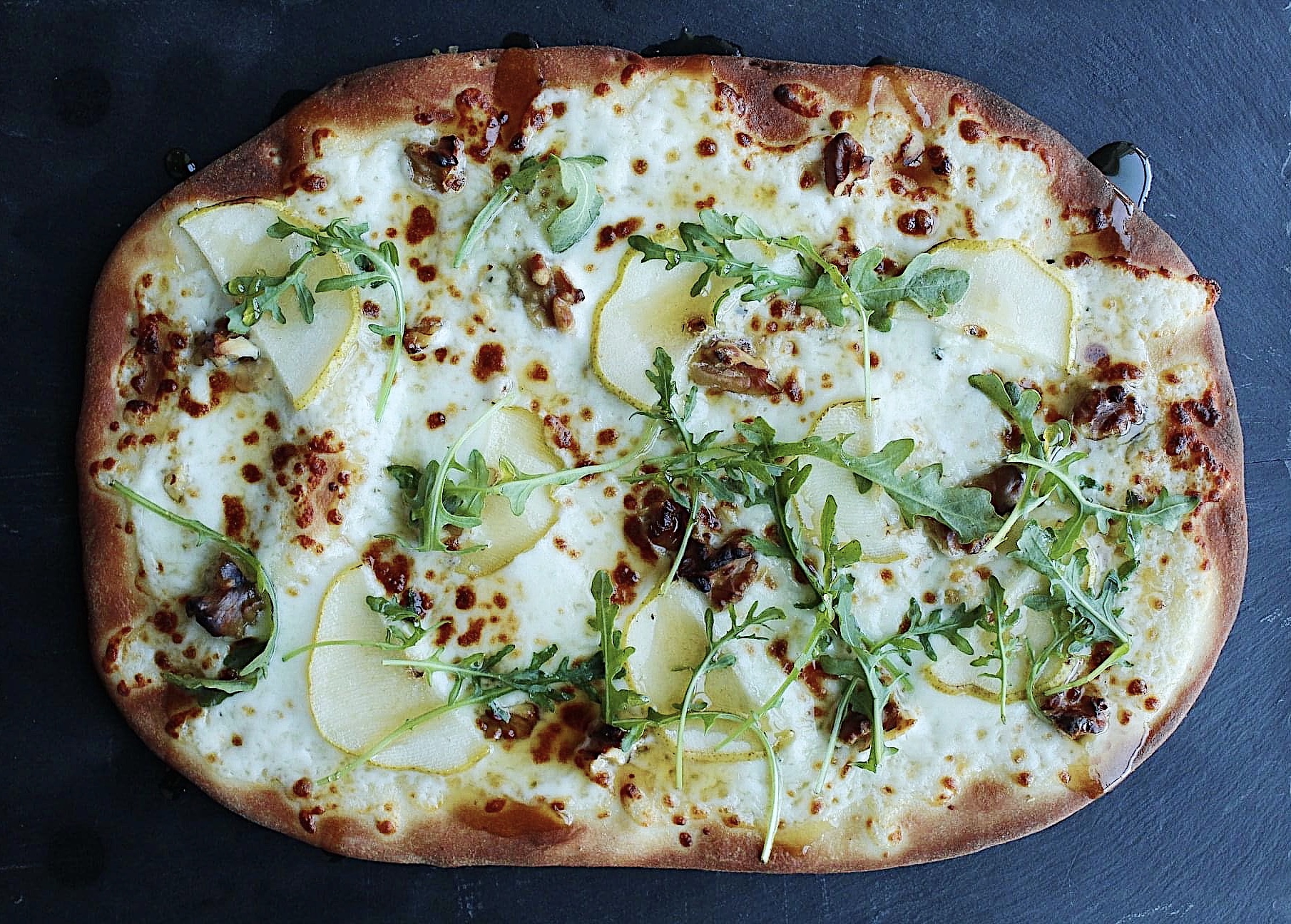 Order Pear Walnut and Blue Cheese Flatbread food online from Karmic Grounds store, Frisco on bringmethat.com