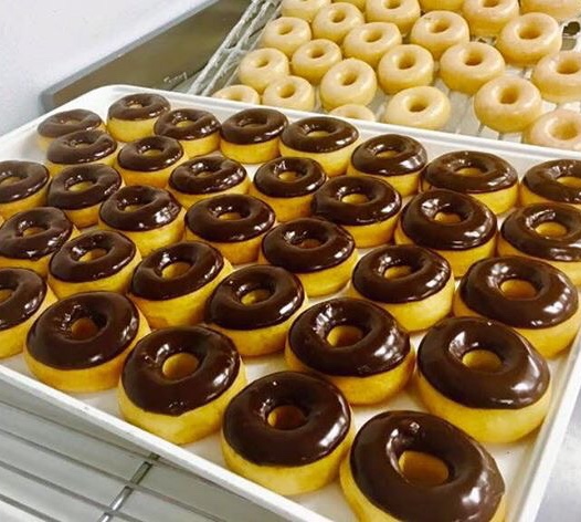 Order One Dozen Chocolate Iced Donuts +2 EXTRA FREE food online from Ashley Donuts store, Houston on bringmethat.com