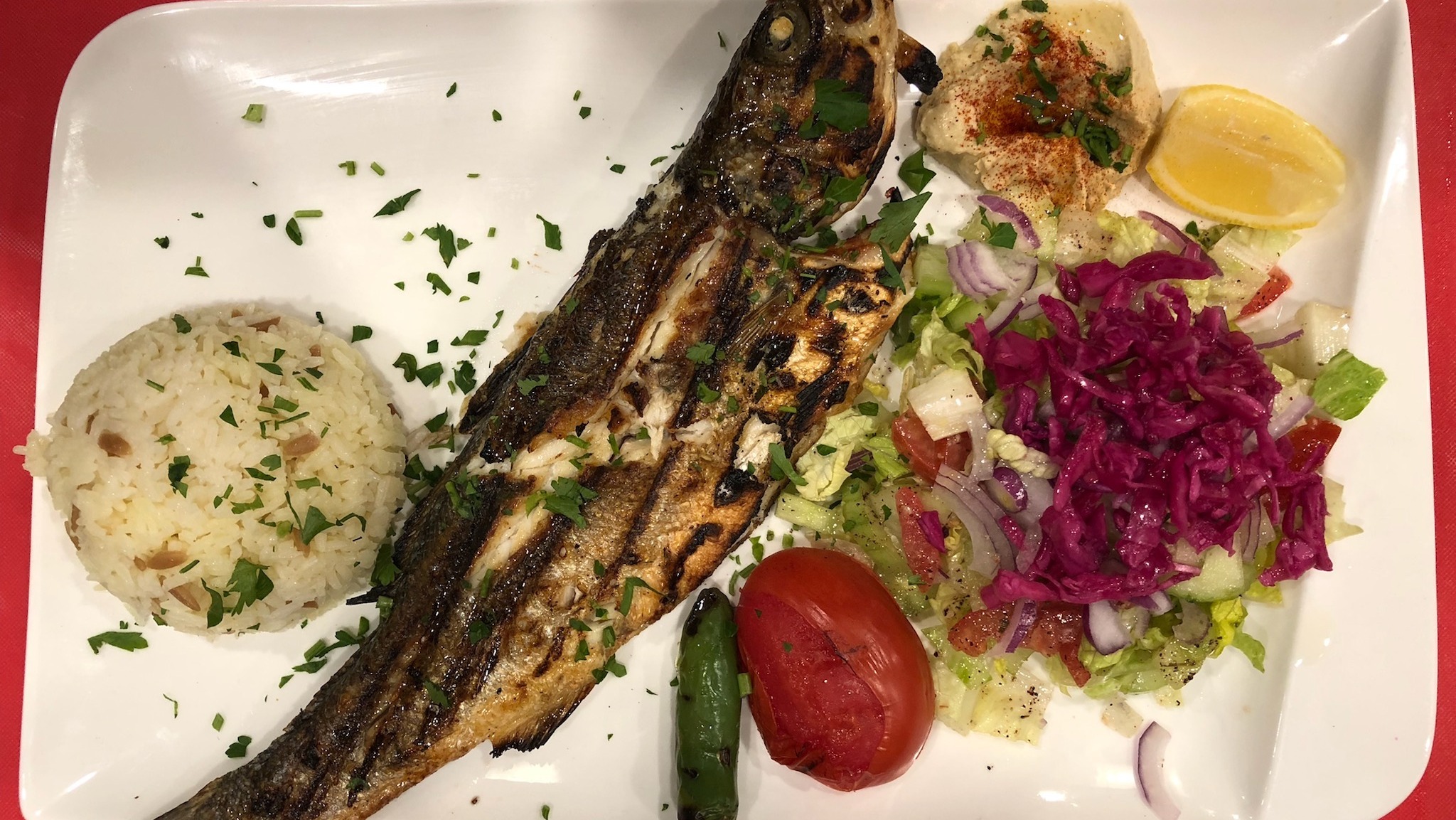Order Grilled SeaBass(Branzino) Fish Plate food online from Istanbul Grill store, San Francisco on bringmethat.com