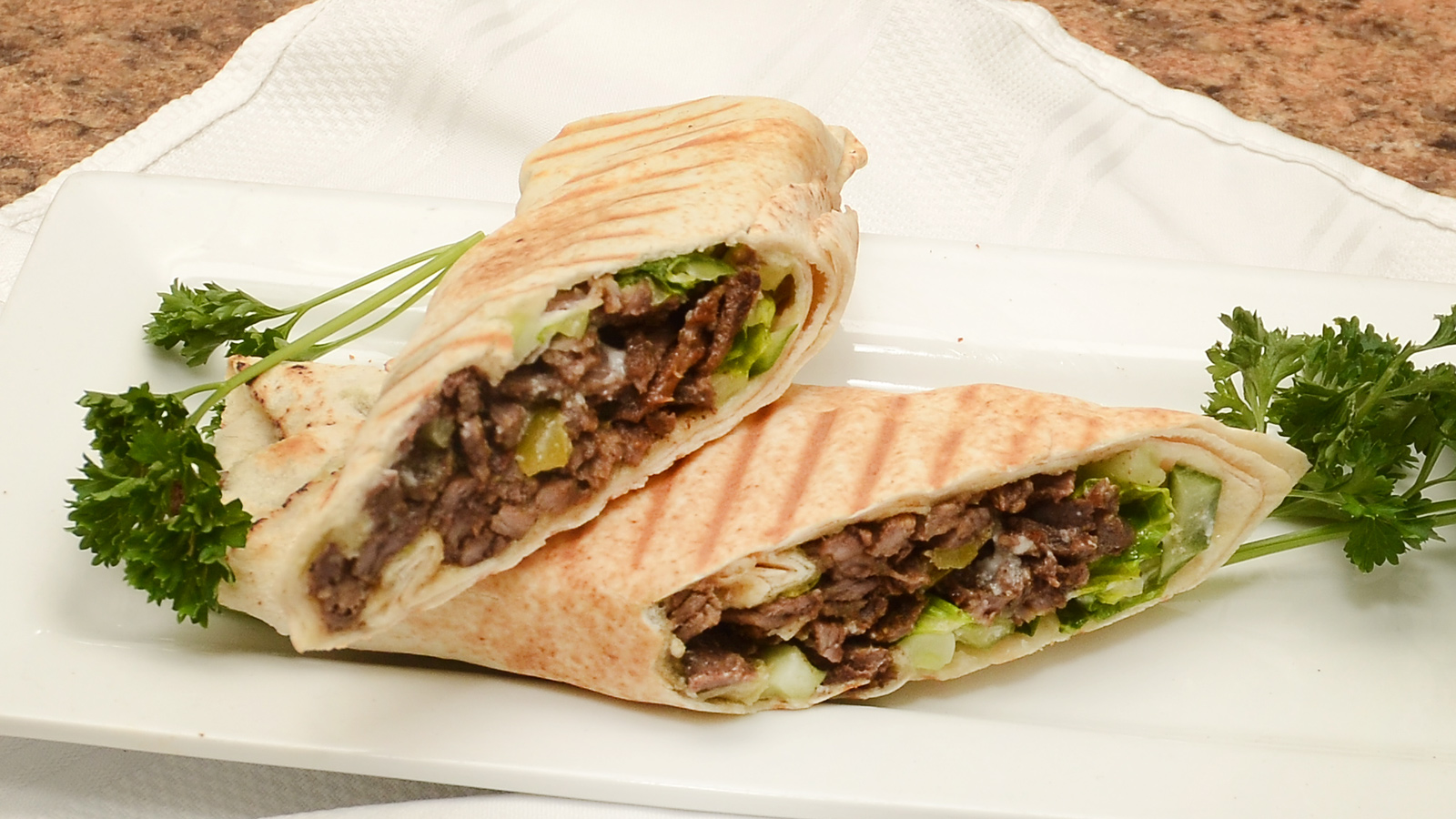 Order Beef Shawarma Sandwich food online from Princess Mediterranean Grill store, Commerce Charter Township on bringmethat.com