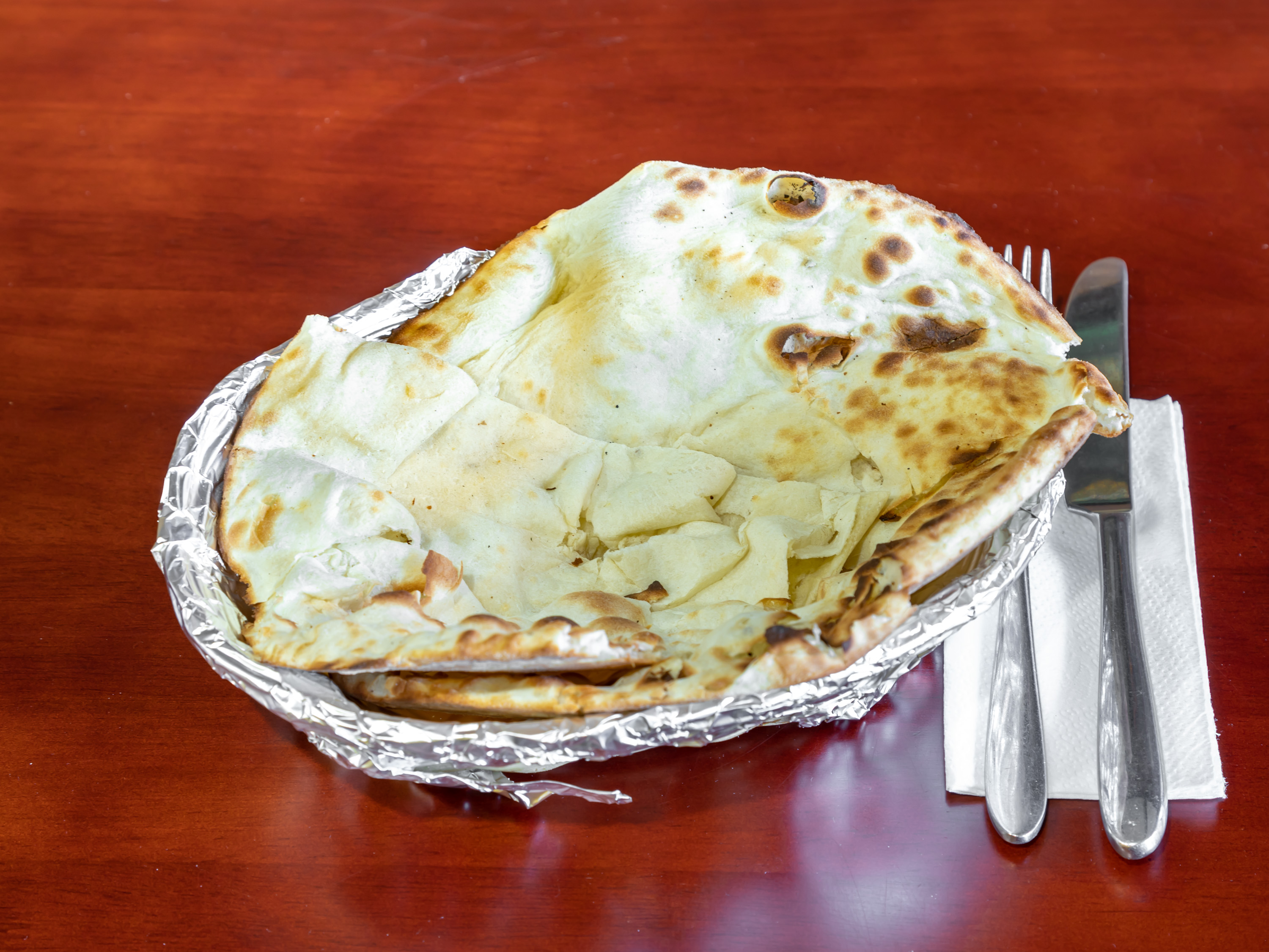 Order Naan Plain food online from Sapphire Indian Restaurant store, Brooklyn on bringmethat.com