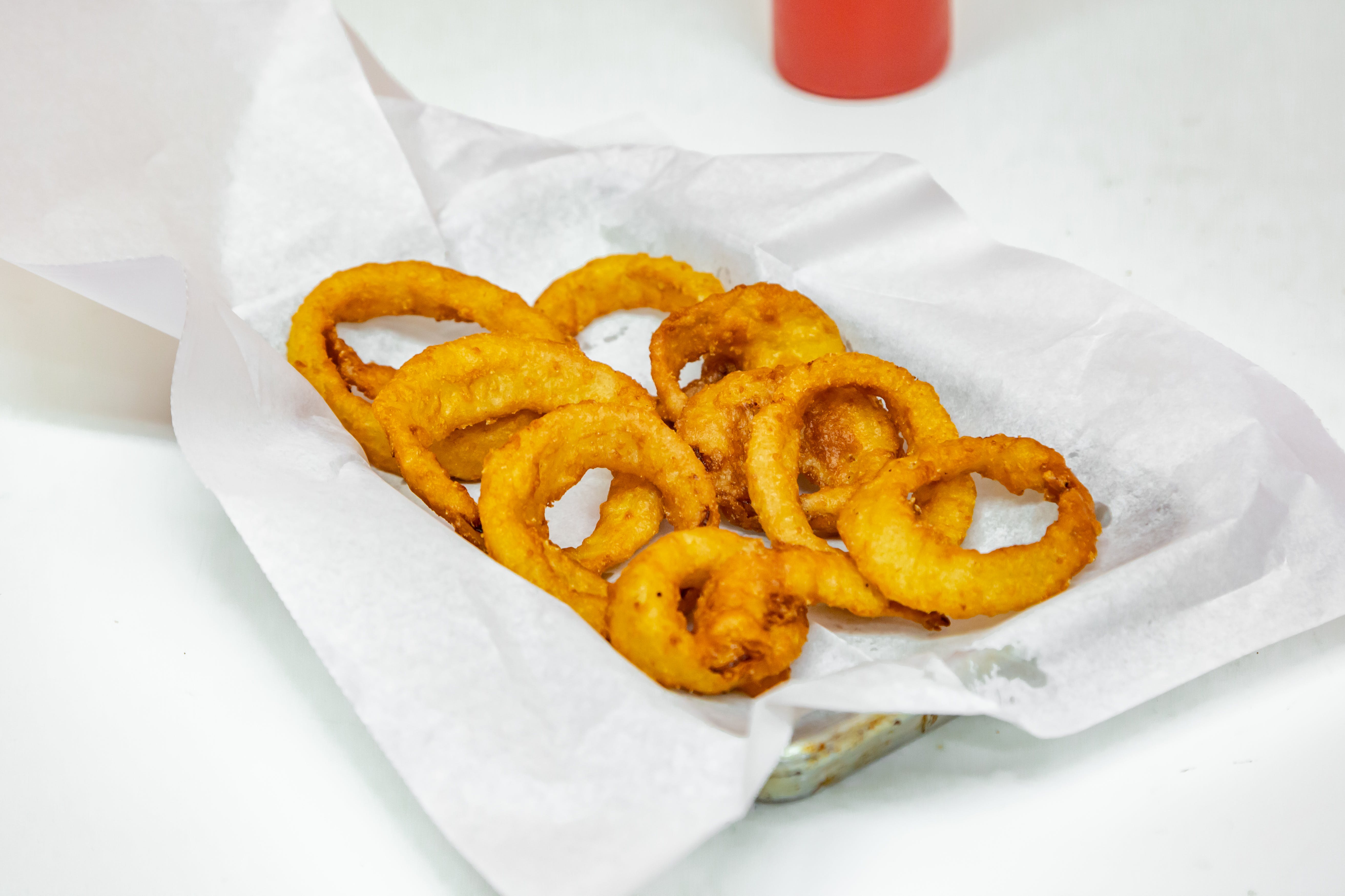 Order Onion Rings - Side food online from Benny's Pizza store, Chicago on bringmethat.com
