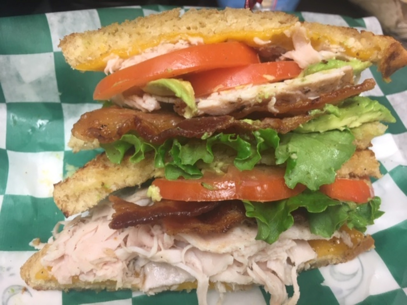 Order HALF Godfather-Turkey Avocado BLT food online from Bookworms Cafe store, Mountain Home on bringmethat.com