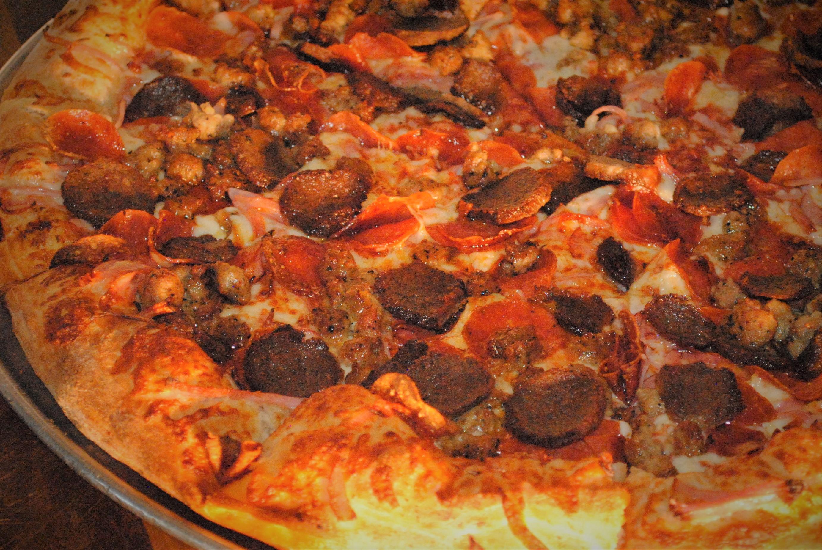 Order Large 20" Meat Lover's Pizza - 12 Slices food online from Vincenzo's Pizza Newhall store, Newhall on bringmethat.com
