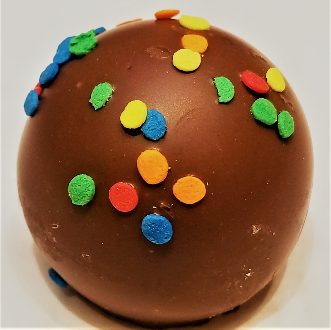 Order Birthday Cake Truffle food online from Rocky Mountain Chocolate Factory store, Tempe on bringmethat.com