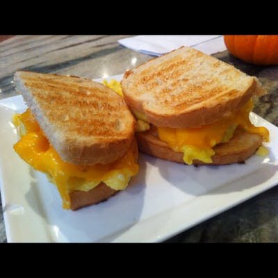 Order Eggs & Cheese Breakfast Sandwich food online from Newport Quik Stop Cafe store, San Diego on bringmethat.com