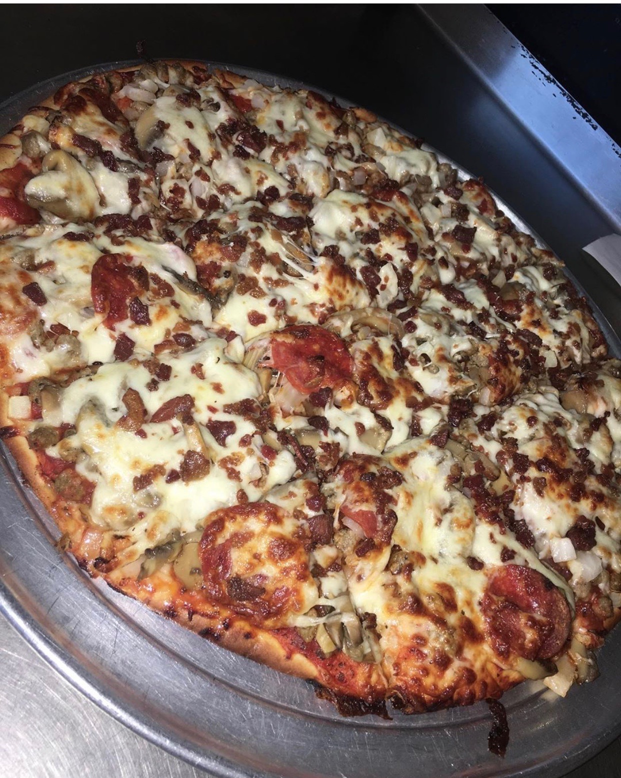Order All Meat Pizza food online from Angilo's Pizza store, Louisville on bringmethat.com