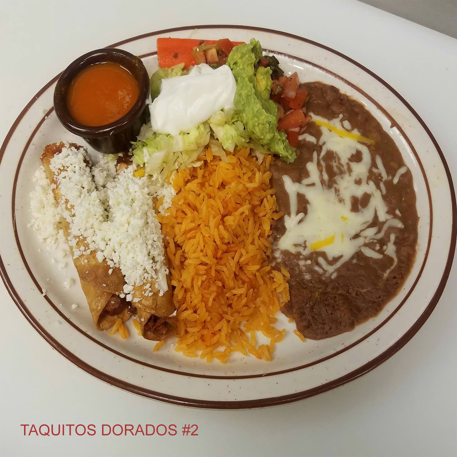 Order 2 Taquitos Dorados Lunch food online from Jacky's Restaurant store, Sioux Falls on bringmethat.com