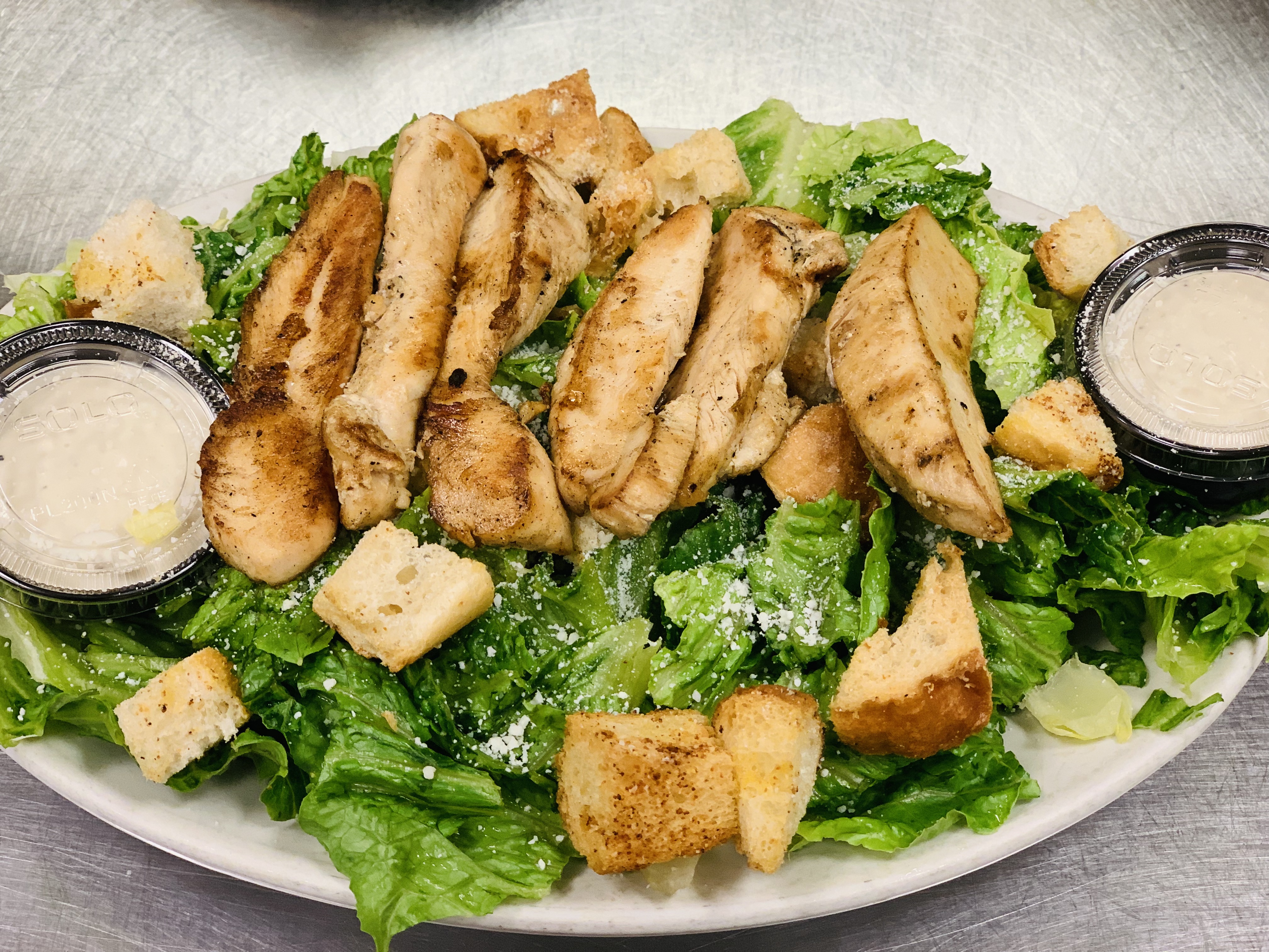 Order Ceaser Chicken Salad food online from Mojo Pub -N- Grill store, Youngstown on bringmethat.com