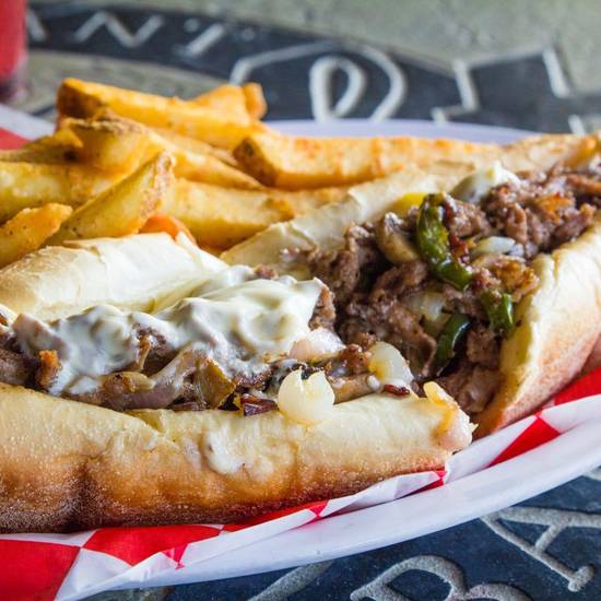 Order Philly Cheese Steak food online from The Draft Restaurant & Sports Bar store, San Diego on bringmethat.com
