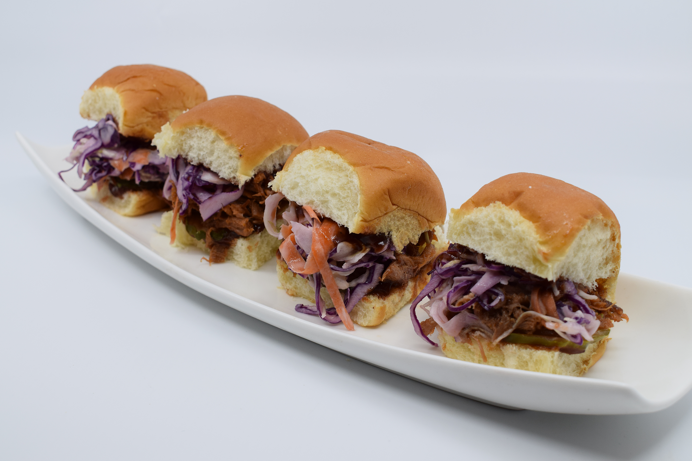 Order 4 PULLED PORK SLIDERS food online from Mad House Comedy Club store, San Diego on bringmethat.com