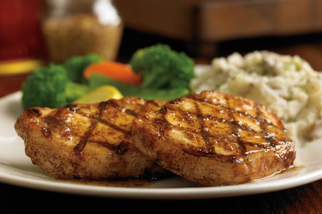 Order Grilled Pork Chop* food online from Outback Steakhouse store, Southaven on bringmethat.com