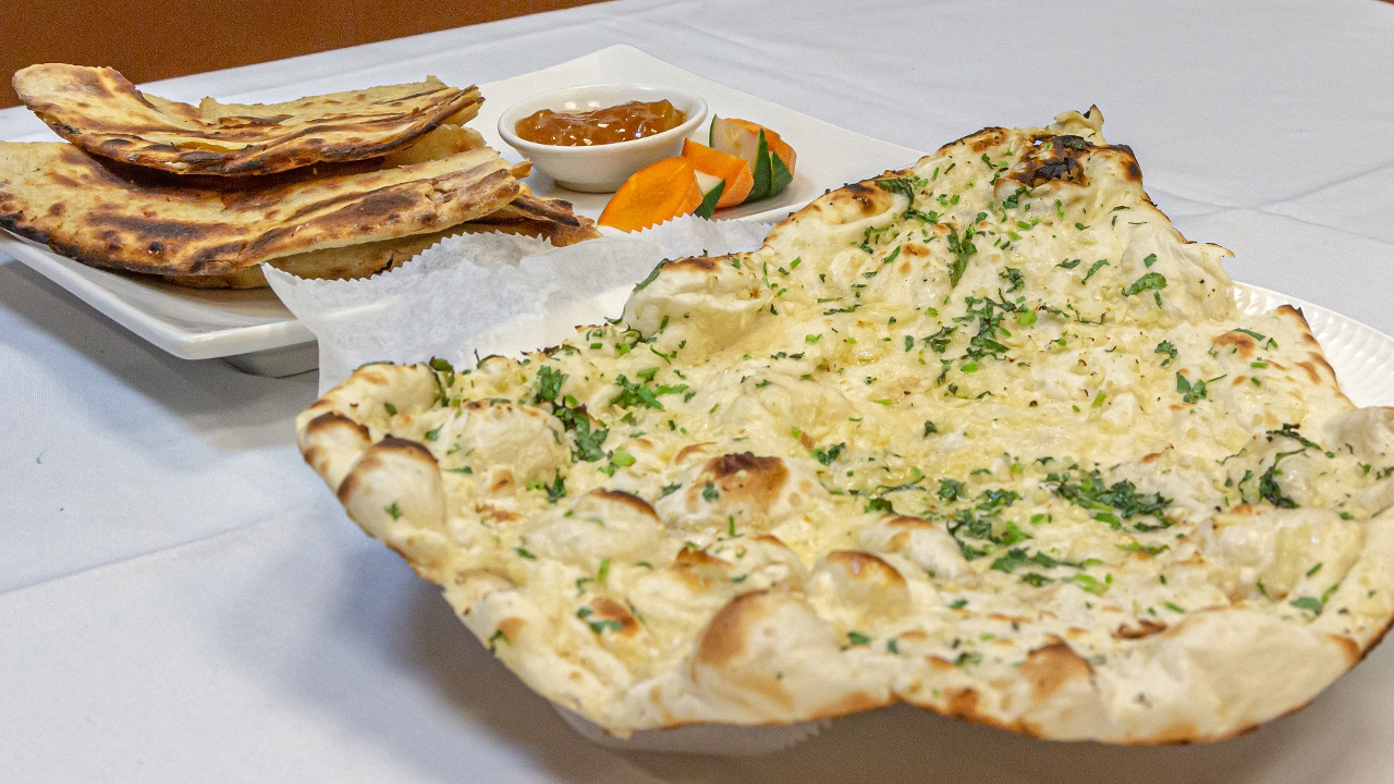 Order Garlic Naan food online from Spice symphony store, New York on bringmethat.com