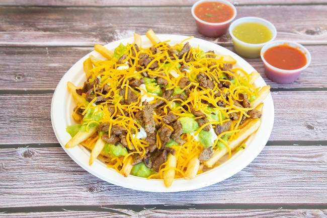 Order Carne Asada Fries-1/2 food online from Sombrero Mexican Food store, San Diego on bringmethat.com