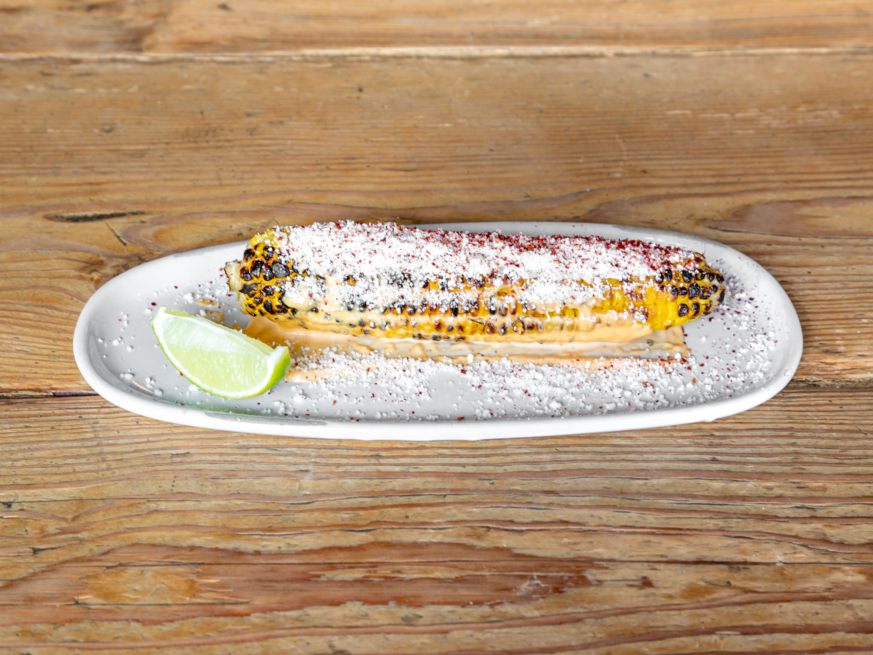 Order Elote food online from Barrio Chino store, New York on bringmethat.com