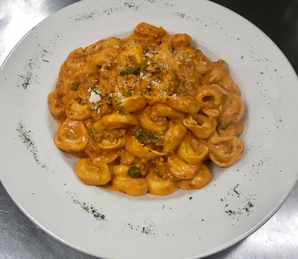 Order Tortellini Bolognese Pasta food online from Richie's Pizza store, Deer Park on bringmethat.com