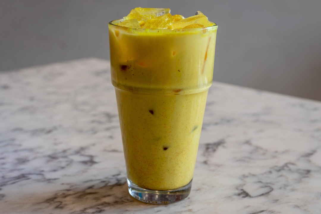 Order Iced Turmeric Latte - 16oz food online from Diesel Cafe store, Somerville on bringmethat.com