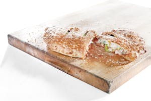 Order Deluxe Stromboli food online from Fox's Pizza Den store, Freedom on bringmethat.com