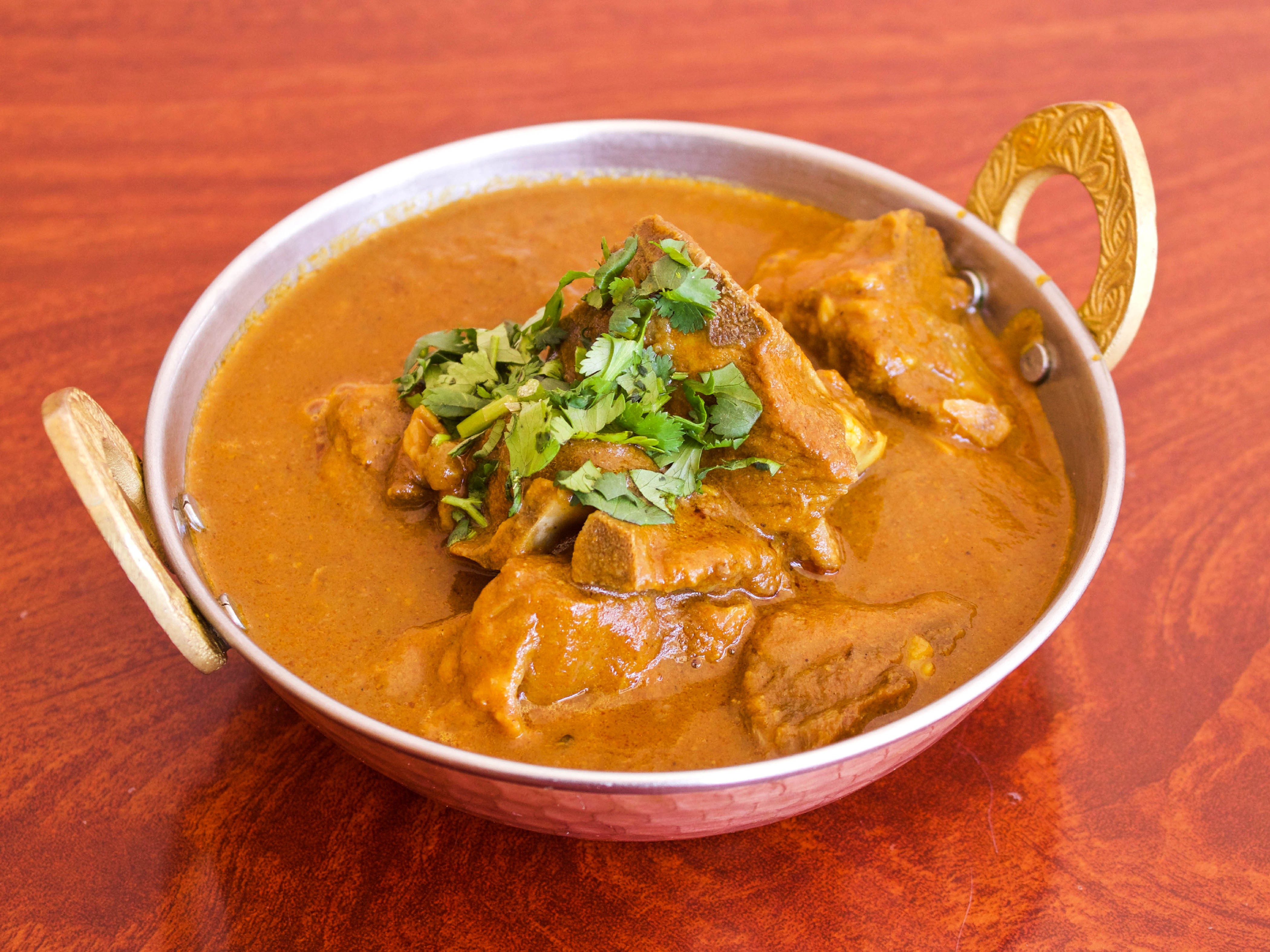 Order Goat Curry food online from Mehak Of India store, San Jose on bringmethat.com