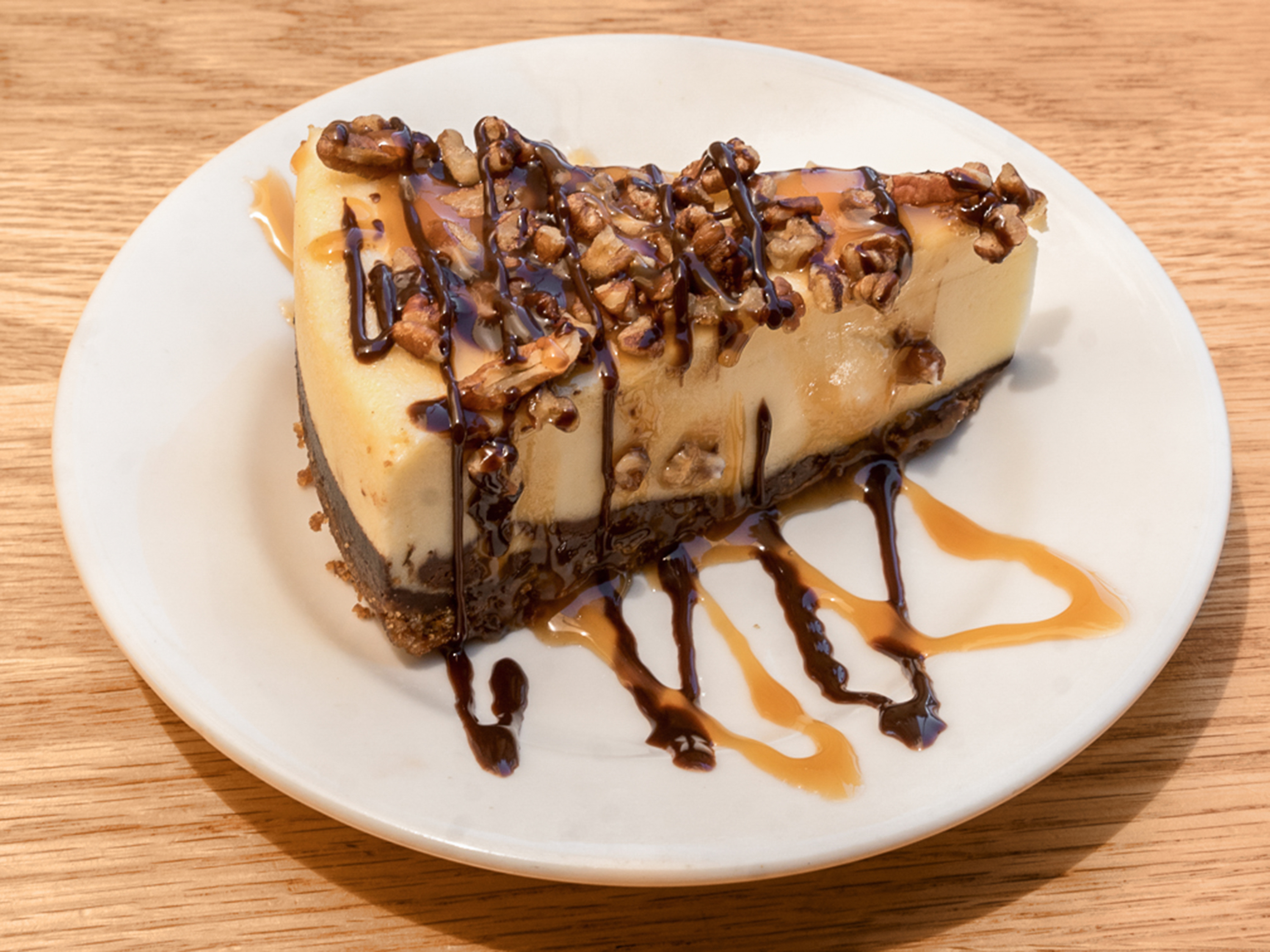 Order Turtle Cheesecake food online from Hungry Hunter Steakhouse store, Bakersfield on bringmethat.com